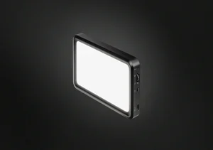 Elgato Key Light Mini portable LED panel light, illuminated, shown at an angle against a dark background